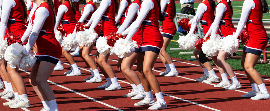 Cheerleaders on the sidlines performong for the crowd Stock Photo | Adobe  Stock