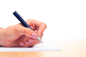 female hands write in a notebook . Office place  - Image