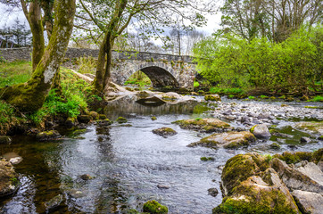 Fototapeta na wymiar Skelwith bridge named after the village of Skelwith and bridging the river Brathay flowing down from Elterwater in the Langdale Fells North of England.