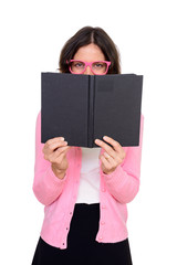 Studio shot of happy woman hiding behind book isolated against white background