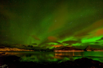 winter landscape with aurora, sea with sky reflection and snowy mountains. Nature, Lofoten Aurora...