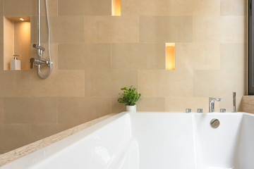 Modern tap and white ceramic bathtub bathroom with wall lamp interior building decoration
