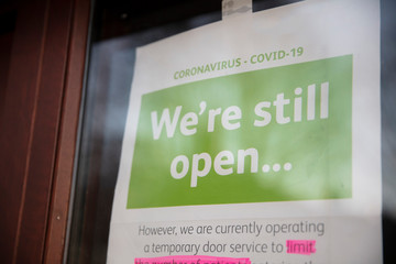 A sign outside a shop promoting social distancing during coronavirus outbreak