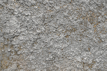 Natural natural texture of concrete with gray and gold stucco in macro shot