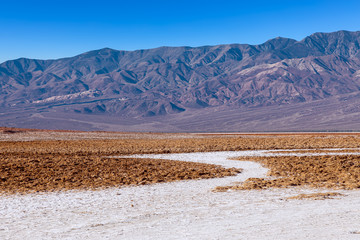 View of the Basins salt flats, Badwater Basin, Death Valley, Inyo County, salt Badwater formations in Death Valley National Park. California, USA