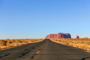 Empty scenic highway (Highway 163) leading to Monument Valley. Arizona, USA.