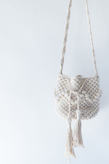 Handmade macrame on white background.