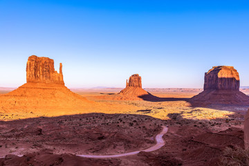Fototapeta na wymiar Beautiful panoramic sunset view over famous Buttes of Monument Valley on the border between Arizona and Utah, USA
