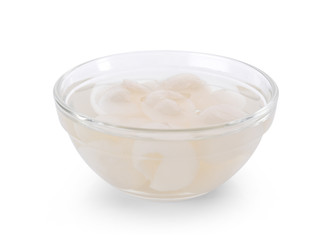 Longan syrup in glass on white background.