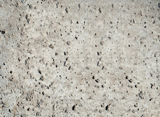 Natural natural texture of a stone slab with gray plaster in macro shot