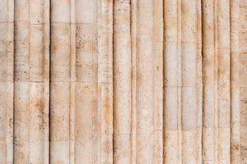 Wavy decoration of an entrance what looks like narrow pillars.