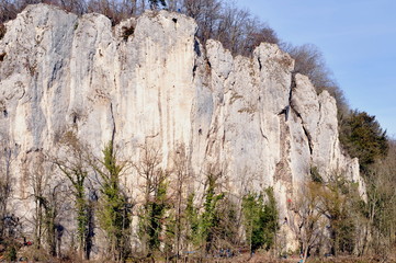 Rock climbers on wall at danube river