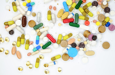 various Pharmaceutical tablets, capsules, therapy drugs and pills on white background