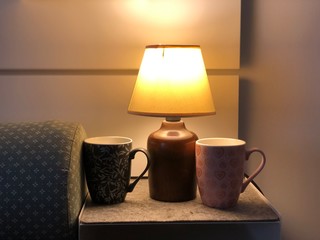 lamp on the table with coffee cups