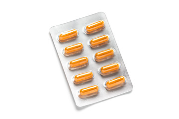 Turmeric capsules or Curcuma capsules in blister pack, medicines for health, pharmaceutical health care and sciences concept, shallow depth of field
