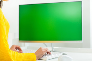 Woman working from home during Coronavirus quarantine. Health care. Staying at home. Women's hands close up, working at the computer with green screen