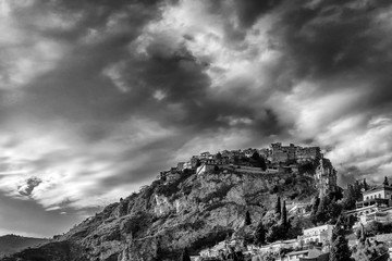 Breathtaking black and white view of the Sicilian village of Castelmola from Taormina, in the province of Messina, Sicily, Italy