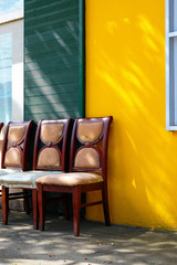 Old chair and colorful wall.