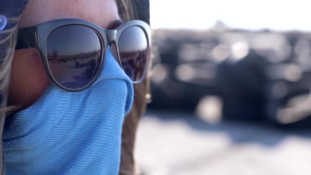 The girl in the coronavirus mask. Portrait of young woman wearing protective mask outdoors. N1H1 coronavirus, virus protection, epidemic in the world