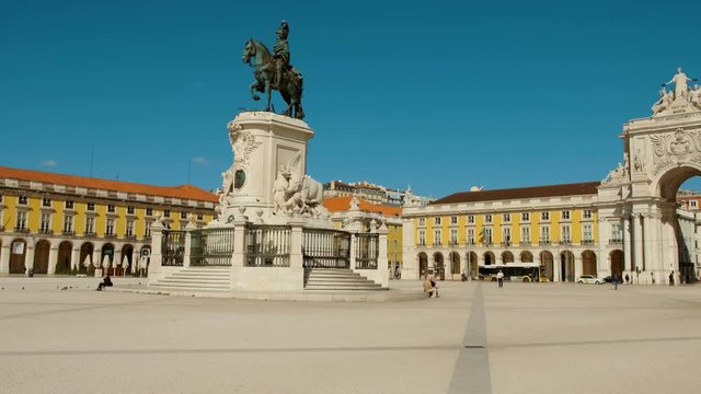 Wide shot of the shot of Commerce Square in Lisbon, Portugal featuring the Rua Augusta Arch and the statue of the king D. Jose I. The Baixa Pombalina downtown district covers over 235,000 sq. m. 