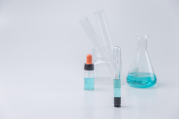 Flask,test tubes,dropper,mask with lab glassware  in chemical and science laboratory , medical tools.  Research and development concept.