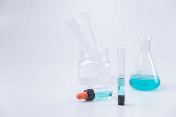 Flask,test tubes,dropper,mask with lab glassware  in chemical and science laboratory , medical tools.  Research and development concept.