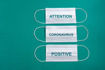 Surgical mask over minimalist green background