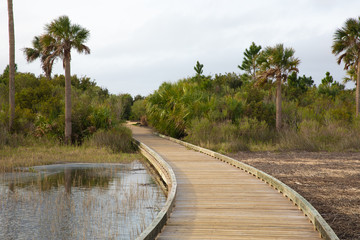 Fototapeta na wymiar Boardwalk over a salt marsh along the intracoastal waterway in Florida.