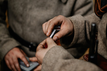 13.10.2019 Vinnitsa, Ukraine: military actors hold weapons of World War II, original guns and pistols. Military reconstruction of guerrilla fighting in Ukraine