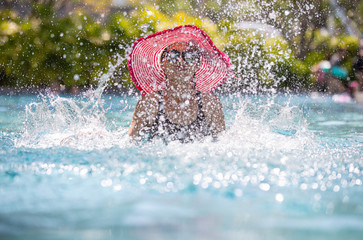 Woman playing in swimming pool