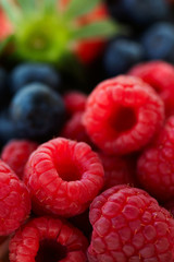 fresh raspberries and blueberries close up