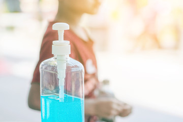 Antiseptic hand gel or alcohol gel prevent the spread of germs and bacteria and avoid infections corona virus,covid-19 prevention for serving customers in the gas station.