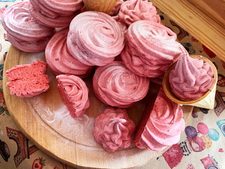 Delicate berry marshmallow. Juicy marshmallow sprinkled with powdered sugar.