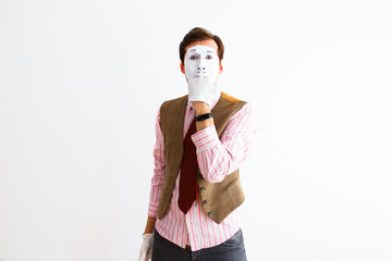 A portrait of a man, an actor, a pantomime, a man makes a panic, aggression gesture. Emotions,...