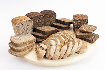 Assortment of bread on the kitchen table on a white isolated background