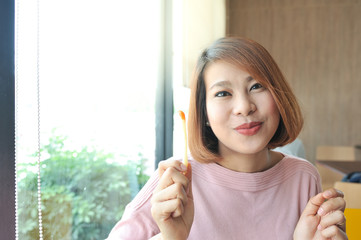 Asian women smile and enjoy her lunch with eatting french fries,selective focus