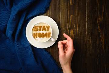 Cup of coffee with text STAY HOME