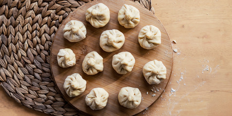 Dumplings on a wooden plate