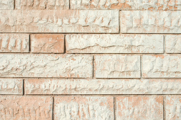 Light yellow background. Wall of light decorative brick close up. Copy space. Place for text. Selective focus image.
