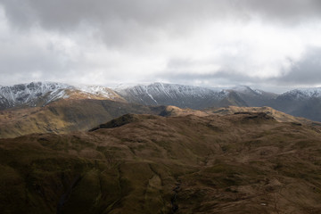 Snow covered summits of High Street Range from Place Fell, Lake District, UK