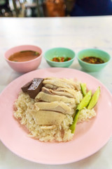 Steamed rice with chicken (Kao Mun Gai) served with ginger garlic sauce and soup. 