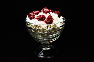 Cottage cheese cherries on a black background