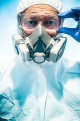 corona virus concept. male doctor putting on mask