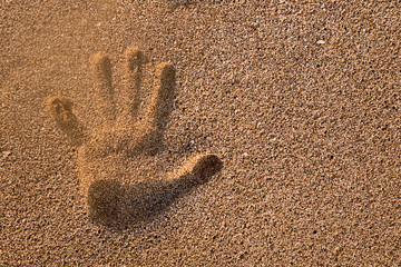 Handprint in the sand