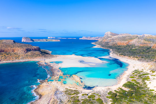 Amazing view of Balos Lagoon with magical turquoise waters, lagoons, tropical beaches of pure white sand and Gramvousa island on Crete, Greece