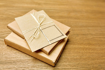 Stack of envelopes from craft paper on a wooden