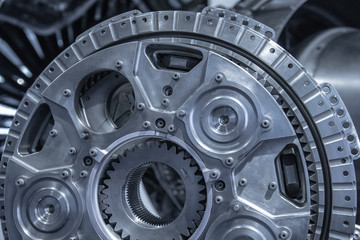 Jet engine gear wheels, industrial background.