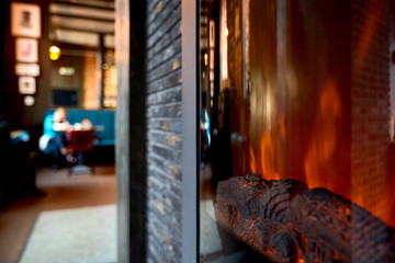 Fototapeta na wymiar Artificial fireplace interior cafe for print