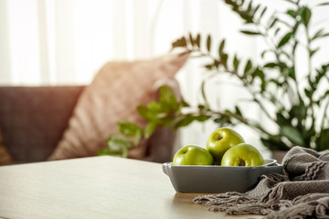 Table background in home interior and blurred window space 