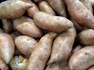 pile of fresh sweet potatoes